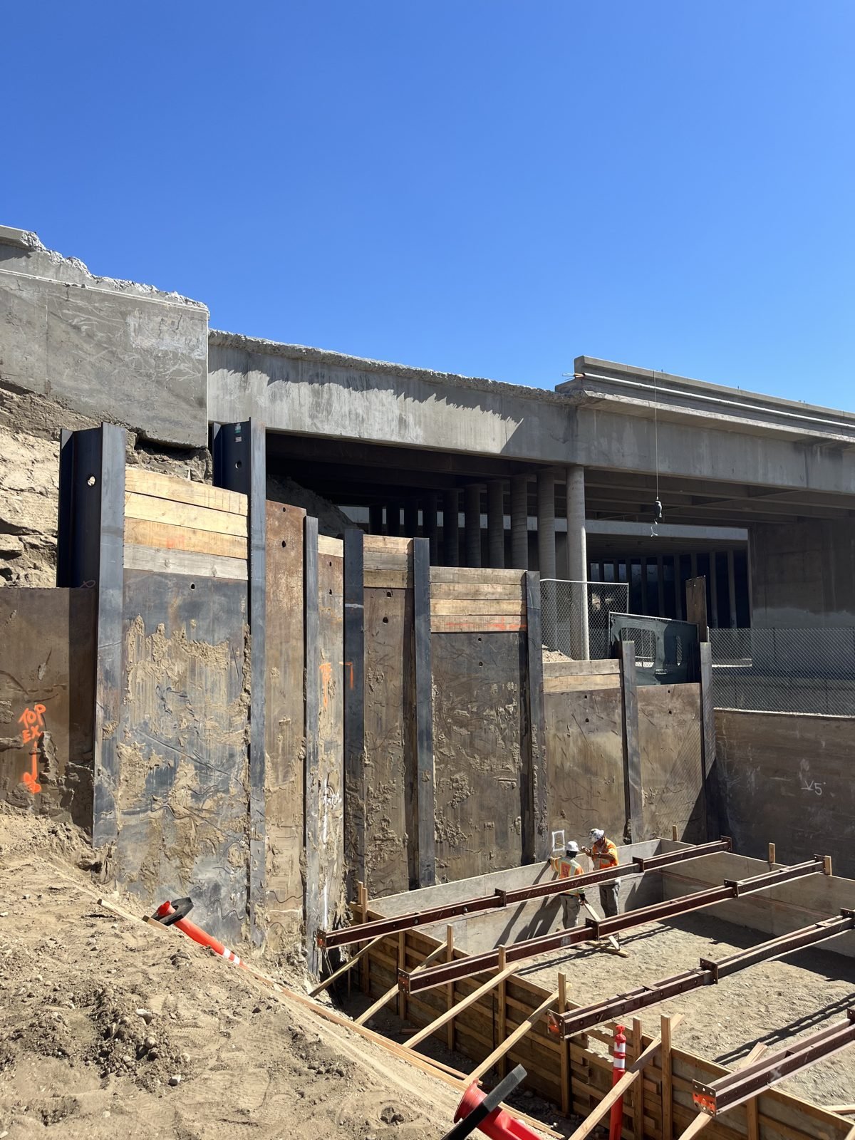 Soldier pile and steel plate lagging shoring at a bridge abutment