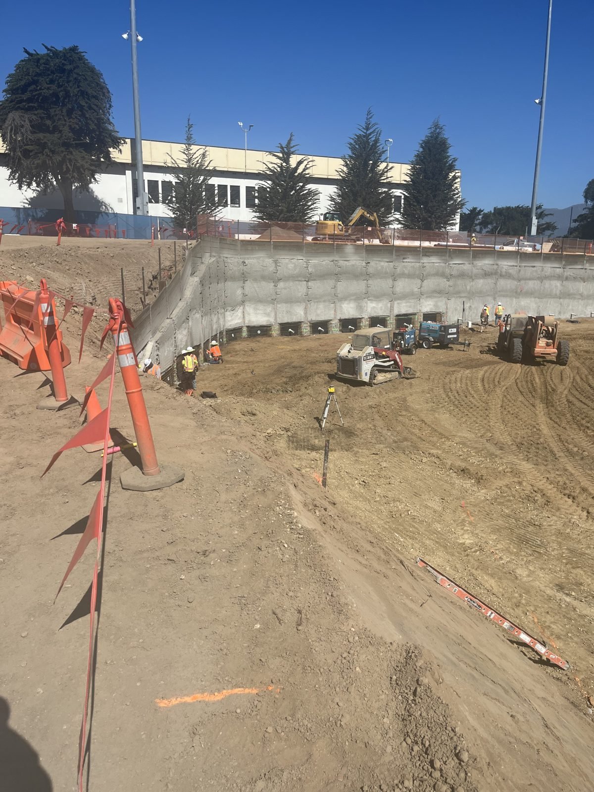 Temporary cantilever pile wall supporting a construction access ramp